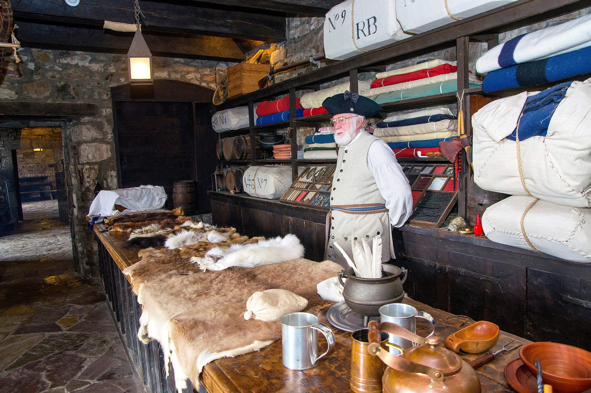 This is the fort's trade room, which saw decades of trade between the French and Native communities on the early Niagara frontier. Here, interpreter Art Hannah explains the types of furs that were traded, which visitors are encouraged to touch.